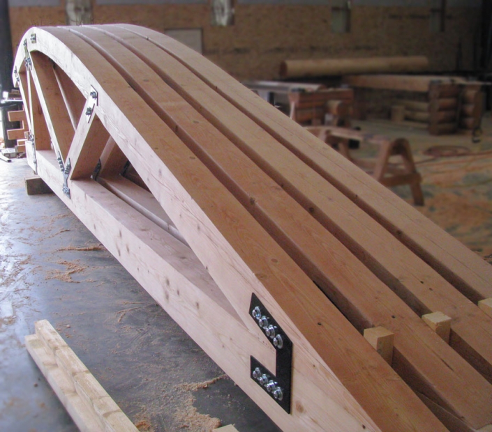 Arched curved timber trusses ready to ship